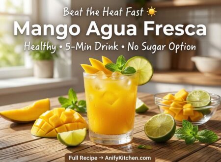 Refreshing mango agua fresca in glass with ice, lime, and fresh mango slices, healthy summer drink recipe