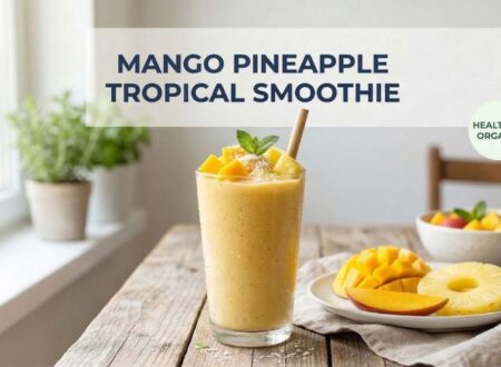 healthy mango pineapple smoothie recipe in glass with fresh mango and pineapple